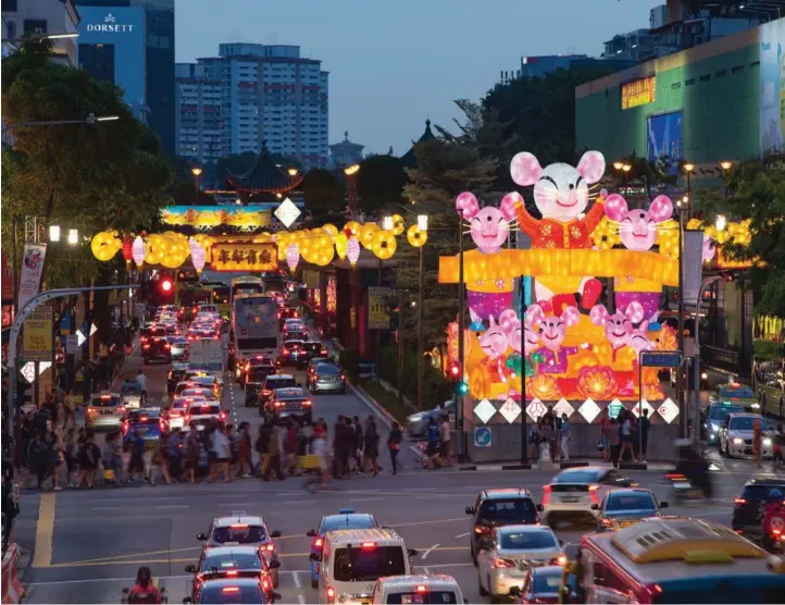  ?? SAMUEL ISAAC CHUA/THE EDGE SINGAPORE ?? Chinatown lights up to welcome the Year of the Rat. Global growth is expected to slow further this year and investors can expect periodic bouts of market volatility