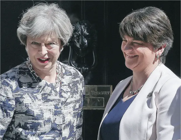  ?? DANIEL LEAL- OLIVAS / AFP / GETTY IMAGES ?? Britain’s Prime Minister Theresa May, left, with Democratic Unionist Party (DUP) leader Arlene Foster at 10 Downing Street on Monday.