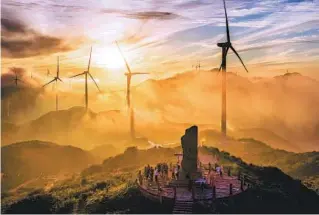  ?? ZHU HAIPENG / FOR CHINA DAILY ?? Wind turbines dominate the mountain ridge at the Baguanao Scenic Area in Shicheng county, Jiangxi province, on Aug 30.