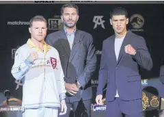  ?? AFP ?? Saul Alvarez, left, and Dmitry Bivol, right, pose during a press conference.