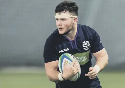  ??  ?? 0 Hooker Ewan Ashman scored a couple of tries in Rosario yesterday but defeat leaves the Scots’ youngsters battling to avoid relegation.