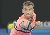  ?? DITA ALANGKARA/THE ASSOCIATED PRESS ?? Bulgaria’s Grigor Dimitrov beat Australian Nick Kyrgios on Sunday to advance to the quarterfin­als of the Australian Open in Melbourne, Australia.