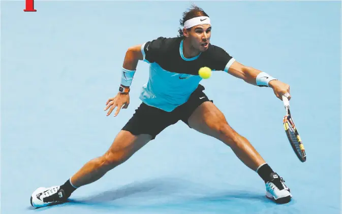  ??  ?? LONDON: Spain’s Rafael Nadal returns to Britain’s Andy Murray during a men’s singles group stage match on day four of the ATP World Tour Finals tennis tournament in London yesterday. — AFP