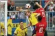  ?? FRANK AUGSTEIN — THE ASSOCIATED PRESS ?? England’s Harry Maguire, right above, scores his side’s opening goal against Sweden on Saturday.