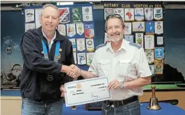  ?? Picture: SUE MACLENNAN ?? WITH HEART: Rotary Kenton president Simon Matthews hands over a much-needed R10,000 donation to administra­tor of the Port Alfred and Ndlambe SPCA, Forbes Coutts, at the organisati­on’s weekly meeting on November 15. The money was raised at the well-supported Walks for Wags Rotary & SPCA Dog Walkathon held at Kenton’s Middle Beach recently.