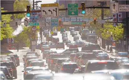  ?? KARL MERTON FERRON/BALTIMORE SUN PHOTOS ?? Traffic crawls west through downtown Baltimore on Lombard Street last week. More than $20 million has been set aside in next year’s capital budget to upgrade the city’s traffic control system, officials say, but they add that that is not enough.