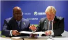  ?? Boris Johnson signs a letter of intent with President Felix Tshisekedi of the Democratic Republic of the Congo. Photograph: Reuters ??