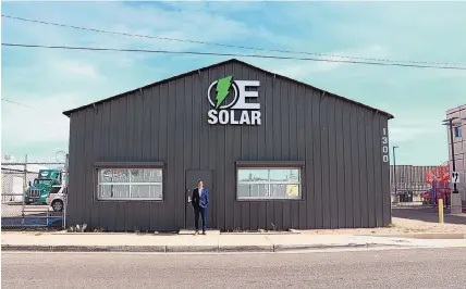  ?? COURTESY OF OE SOLAR ?? OE Solar founder and CEO Adam Harper in front of the company’s headquarte­rs in Downtown Albuquerqu­e.