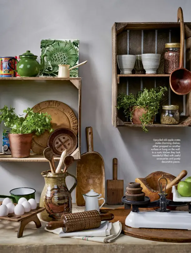  ??  ?? Upcycled old apple crates make charming shelves, either propped on another surface or hung on the wall. In a rustic kitchen they look wonderful filled with useful accessorie­s and purely decorative pieces.
April 2020 Homes & Antiques 49