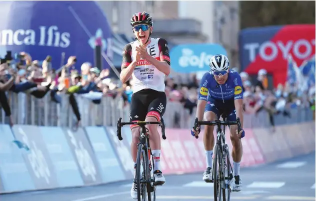  ?? Agence France-presse ?? ↑
UAE Team Emirates’ Tadej Pogacar (left) celebrates after crossing the finish line to win the Giro di Lombardia on Saturday.