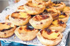  ?? TURISMO DE LISBOA ?? Clássicos. Caravelas e pastéis de nata são a combinação perfeita para uma viagem pela história e pelas delícias da capital portuguesa