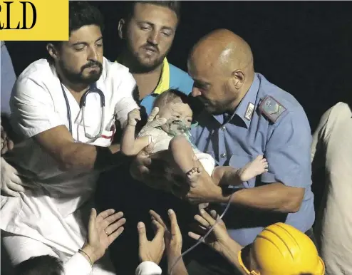  ?? ANSA VIA THE ASSOCIATED PRESS ?? Rescuers pull a seven-month-old boy, Pasquale, from the rubble of a collapsed building in Casamiccio­la, on the island of Ischia, near Naples, Italy, on Tuesday, a day after a 4.0-magnitude quake hit the Italian resort island.