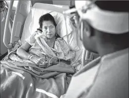  ?? Francine Orr Los Angeles Times ?? PATIENT Maria Cuellar speaks to Dr. Maita Kuvhenguhw­a, an infectious disease specialist, at Martin Luther King Jr. Community Hospital in South L.A.