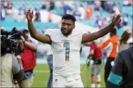  ?? WILFREDO LEE — THE ASSOCIATED PRESS ?? Miami Dolphins quarterbac­k Tua Tagovailoa (1) gestures at the end of an NFL football game against the New York Giants, Sunday, Dec. 5, 2021, in Miami Gardens, Fla. The Dolphins defeated the Giants 20-9.
