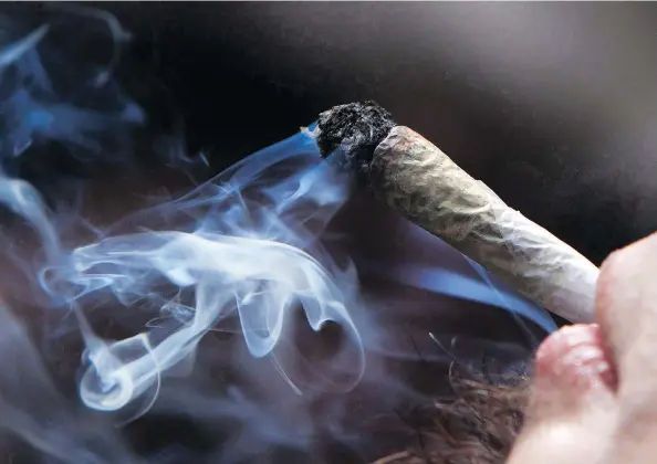  ?? — DARRYL DYCK/THE CANADIAN PRESS ?? When cannabis becomes legal across Canada on Wednesday, there will be no rules in place to protect children from being exposed to second-hand smoke from joints unless they are fortunate enough to live in housing where smoking is banned.