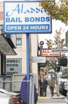  ?? Liz Hafalia / The Chronicle ?? Aladdin Bail Bonds is one of the businesses across from the Hall of Justice that depend on a cash bail system.