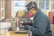  ?? ?? It takes Daniel Spence five passes on the grinder to sharpen the skates, creating a double edge that lends more support to skaters. After applying lubricant and holding the blade against the grinder one more time, Spence uses a wet stone to remove any excess metal.