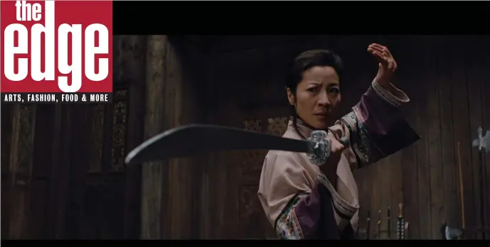  ?? COLUMBIA FILMS — ZUMA PRESS/TNS ?? Michelle Yeoh in “Crouching Tiger, Hidden Dragon,” which popularize­d the idea that kicks and punches can have the grace of ballet