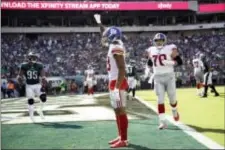  ?? MATT ROURKE — THE ASSOCIATED PRESS ?? New York’s Odell Beckham celebrates after a touchdown during the second half of Sunday’s game against the Eagles.