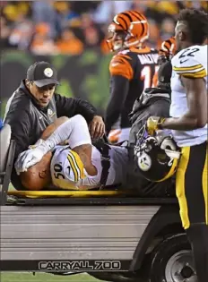  ?? Peter Diana/Post-Gazette ?? The linebacker is carted off the field on Dec. 4 at Paul Brown Stadium in Cincinnati.