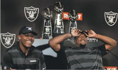  ?? BEN MARGOT/AP ?? Josh Jacobs, left, and Clelin Ferrell landed with the Raiders after the team took surprising steps in the first round.