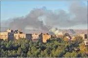  ??  ?? Smoke billows in the Yemeni capital after an airstrike on Friday.
AFP