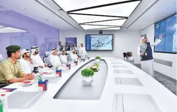  ?? WAM ?? Shaikh Mohammad, Shaikh Hamdan, Mattar Al Tayer and Maj Gen Abdullah Khalifa Al Merri listen to a presentati­on at the Enterprise Command and Control Centre.