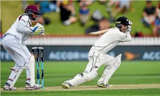  ?? ANDREW CORNAGA/PHOTOSPORT ?? Wellington wicketkeep­er Tom Blundell provided the early highlight yesterday at the Basin Reserve when he became the 11th New Zealand player to score a test century on debut.