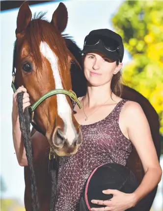  ?? Picture: ALIX SWEENEY ?? BORN FOR IT: Jockey and trainer Chelsea Jokic, pictured with four-year-old Thoroughbr­ed Jack, saddles up two runners on her home track today.