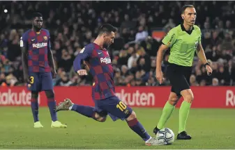  ?? AFP ?? Lionel Messi scores his opening free-kick for Barcelona against Celta Vigo on Saturday