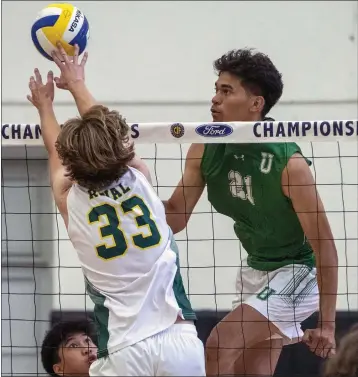  ?? PHOTOS BY ALEX GALLARDO ?? Royal’s Kenneth Woods (33) blocks a hit by Upland’s Cian Slade during the CIF-SS Division 3champions­hip match.