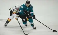  ?? (Stan Szeto-USA TODAY Sports/Reuters) ?? SAN JOSE SHARKS left wing Marcus Sorensen (20) and Vegas Golden Knights right wing Reilly Smith fight for control of the puck in game six of the second round of the 2018 Stanley Cup Playoffs at SAP Center at San Jose.