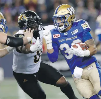 ?? JOHN WOODS/THE CANADIAN PRESS ?? Winnipeg running back Andrew Harris needs 181 yards rushing and 217 receiving yards to become the first CFL player to record 1,000 yards rushing and receiving in the same season.