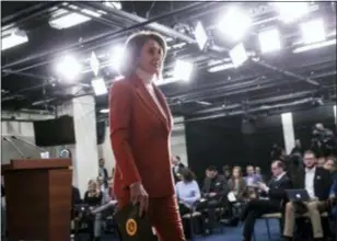  ?? J. SCOTT APPLEWHITE — THE ASSOCIATED PRESS ?? In this photo, House Minority Leader Nancy Pelosi, D-Calif., leaves a news conference at the Capitol in Washington. Pelosi’s bid to return as House speaker is putting newly elected Democrats in a spot. The speaker’s vote will among the first votes cast in the new Congress, with all eyes will be watching — and cameras rolling for TV ads — to see if the incoming freshmen who promised to oppose Pelosi on the campaign trail will actually do so in the House chamber.