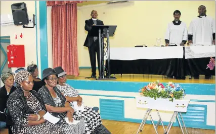  ?? Picture: FREDLIN ADRIAAN ?? STILL IN SHOCK: Sombre residents at the funeral of Luniko Njikelana at the Nangoza Jebe Hall in New Brighton