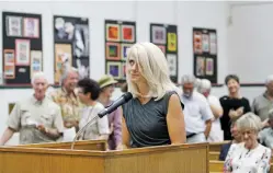  ?? LUIS SÁNCHEZ SATURNO/THE NEW MEXICAN ?? Jennifer Jenkins, whose company represents developer Vegas Verdes, reacts Tuesday as people at the County Commission meeting laughed at her comment that the intersecti­on of Rabbit Road and St. Francis Drive already works well. The commission approved a...