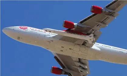  ?? Photograph: Matt Hartman/AP ?? Virgin Orbit Boeing 747-400 rocket launch platform, named Cosmic Girl, takes off from Mojave Air and Space port, north of Los Angeles.