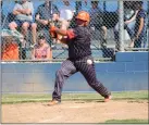  ?? ?? Woodland senior first baseman Anthony Santos hits a foul ball at Casa Roble on Wednesday in Orangevale.