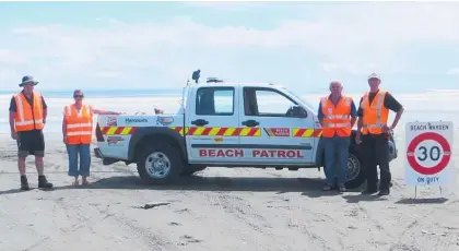  ?? ?? This summer marks 20 years of Waitarere volunteer beach wardens. Pictured are beach warden coordinato­r Craig Dyson with wardens Sharon Freebairn, Peter Freebairn and Kevin Feck.