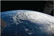  ?? New York Times ?? In a satellite image provided by NASA, Hurricane Harvey spins off the coast of Texas. Researcher­s at a new center are working to understand such storms.