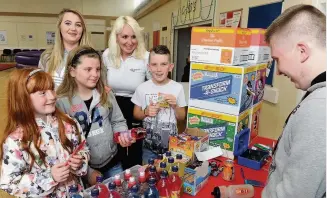  ??  ?? Snacks Youngsters were treated to juice and crisps