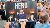  ?? AFP ?? An activist in Washington DC holds a poster of Christine Blasey Ford, who has accused Kavanaugh of assaulting her in 1982.