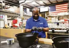  ?? Tyler Sizemore / Hearst Connecticu­t Media ?? Assembly worker Robert Lesperance works on the production floor at Goodway in Stamford.