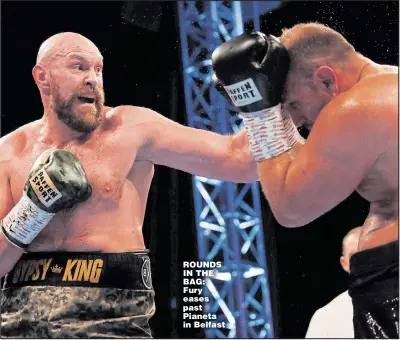  ?? Picture: LEE SMITH ?? ROUNDS IN THE BAG: Fury eases past Pianeta in Belfast