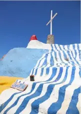  ??  ?? > Salvation Mountain print by Amber Armitage