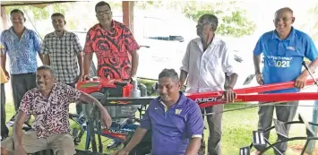  ?? Photo: Shratika Naidu ?? Minister for Agricultur­e, Waterways and Environmen­t Mahendra Reddy (third from left,) with rice farmers during the handing over of power tiller machine at Laqere in Labasa on April 28, 2020.