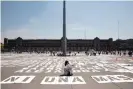  ?? Photograph: Benedicte Desrus/Alamy ?? Women paint the names of victims of femicide in front of Mexico’s national palace before a march on 8 March 2020.