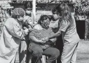  ?? Diego Ramos / AFP via Getty Images ?? A woman gets a COVID-19 shot July 2 in Arequipa, Peru. The lambda variant has been found in 81 percent of samples sequenced in Peru since April.