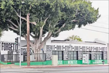  ?? LAXART ?? BARBARA KRUGER’S printed verb commands on the LAXART building are like the frieze on a classical temple’s entablatur­e.