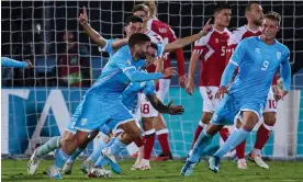  ?? Photograph: Ciancaphot­o Studio/Getty ?? Alessandro Golinucci celebrates scoring San Marino’s goal in the Euro 2024 qualifier against Denmark in October, which they lost 2-1.
Images